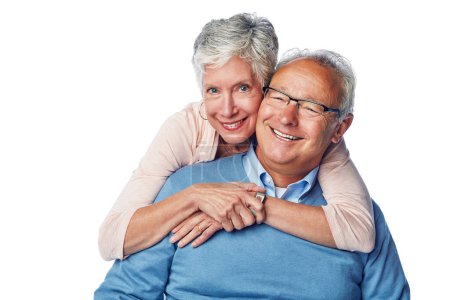Love, portrait and senior couple hug in studio, smile and happy together against a white background. Relax, face and elderly man with woman embrace, holding and enjoy retirement, bond and isolated.