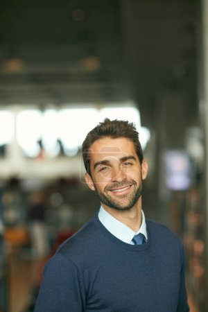 Photo for Create a business that provides quality. Cropped portrait of a handsome young businessman standing alone in a library during the day - Royalty Free Image