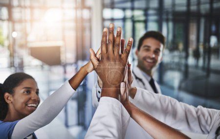 Photo for Lets show the medical industry what were made of. a group of doctors joining their hands in solidarity at a hospital - Royalty Free Image