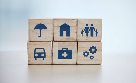 Wooden, cubes or stack in house risk management, security or future protect on background desk mockup or home table. Zoom, building blocks or life insurance in medical, car loan or mock up cog wheel.