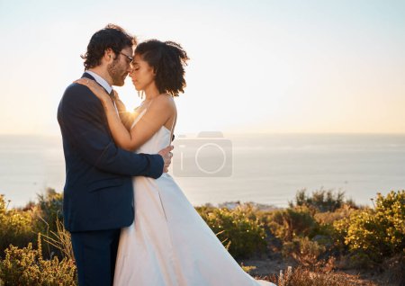 Téléchargez les photos : Love, bride and groom on mountain for wedding celebration, marriage ceremony and commitment. Trust, happy and interracial couple bonding, intimate and calm on romantic holiday, honeymoon and vacation. - en image libre de droit