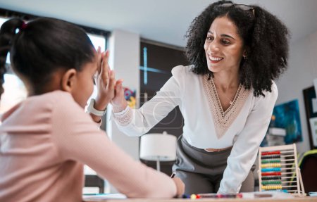 Photo for High five, success or teacher in celebration with a student in a classroom with learning development. Goals, education or happy black woman smiles teaching or celebrates a target with a school girl. - Royalty Free Image