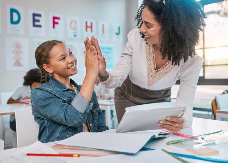 Photo for Tablet, high five and teacher with child education, learning and support, achievement and classroom goal. Mentor, black woman or person and girl in success hand sign for English, language development. - Royalty Free Image