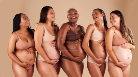 Téléchargez les photos : Pregnant body, portrait or laughing friends on studio background in diversity empowerment, baby support and community. Smile, happy or pregnancy women in underwear with stomach in funny or comic joke. - en image libre de droit