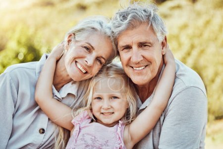 Photo for Grandparents, girl and smile portrait in a family outdoor park happy about a picnic. Children, happiness and kids with elderly grandparent in garden or backyard smiling and bonding together in nature. - Royalty Free Image