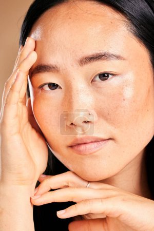 Photo for Asian woman, hands and beauty portrait for skincare wellness, facial dermatology and luxury natural skin glow in studio. Young model, calm face and healthy cosmetics treatment or relax body care. - Royalty Free Image