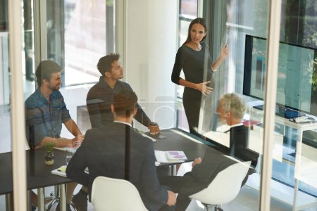 Photo for Taking stock and setting new targets. a corporate businessperson giving a presentation in the boardroom - Royalty Free Image