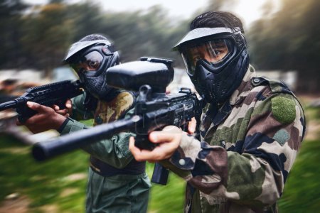 Photo for Training, paintball gun and men in camouflage with safety gear at military game for target practice. Teamwork, shooting sports and war games, play with rifle and friends working together at army park. - Royalty Free Image