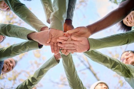 Photo for Teamwork, collaboration and low angle of people with hands together for team building. Motivation, solidarity and group of men and women huddle for unity, union or community, support or cooperation - Royalty Free Image