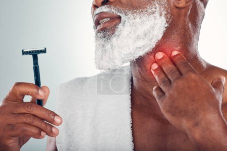 Man, shaving and hand on neck for pain from razor burn or cut while grooming with foam on face. Bathroom beard shave accident, blade and injury on throat, old male model isolated on white background