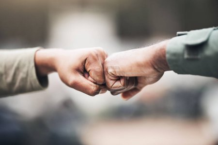 Téléchargez les photos : People, hands and fist bump for agreement, deal or trust in partnership, unity or support on a blurred background. Hand of team touching fists for community, teamwork or collaboration in the outdoors. - en image libre de droit