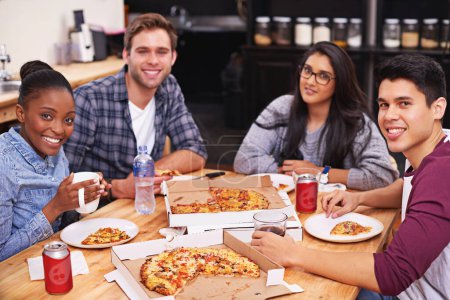 Photo for They love pizza. a group of friends enjoying pizza together - Royalty Free Image