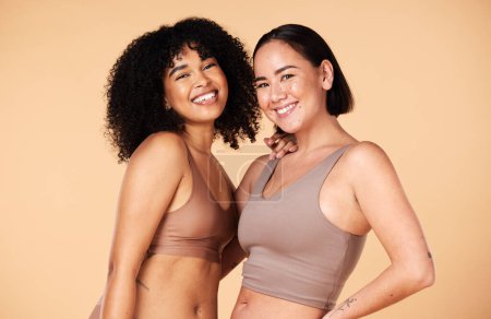 Photo for Diversity, friends and beauty of women in underwear in studio isolated on a brown background. Portrait, lingerie and body positive happy girls with makeup, cosmetics and healthy skincare for wellness. - Royalty Free Image