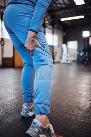 Photo for Leg pain, injury and accident at a gym after exercise, training or sport workout with bruise. Fitness, sports and woman athlete limping from a swollen, inflammation or sprain muscle at a studio - Royalty Free Image