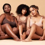 Diversity women, skin and beauty portrait with friends group together for inclusion and power. Natural body model people on beige background with glow, pride and self love motivation in underwear.