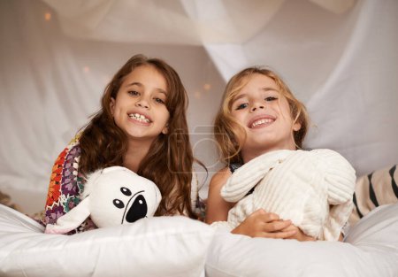 Photo for Saturday sleepover. two cute little girls having a sleepover - Royalty Free Image