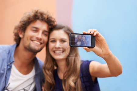 Photo for Say cheese. a young couple taking a selfie on a mobile phone - Royalty Free Image
