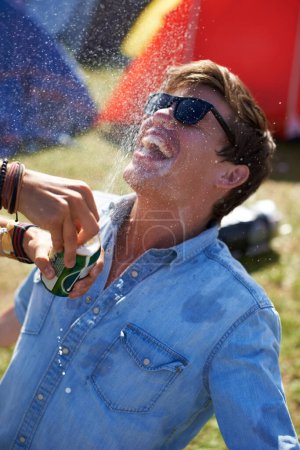 Photo for Too much beer equals too much fun. two friends getting drunk at an outdoor music festival - Royalty Free Image