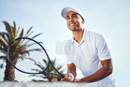 Photo for Give me your best shot. a handsome young man standing alone and holding a tennis racket during a game of tennis - Royalty Free Image