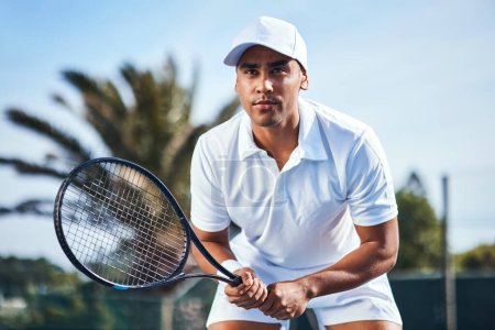 Photo for Im ready, lets play. a handsome young man standing alone and looking contemplative during a game of tennis - Royalty Free Image