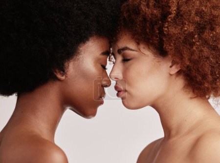 Foto de Beauty, skincare and black women faces together closed eyes for cosmetic skin, self care and isolated in studio background. Facial, dermatology and friends or models for spa treatment for glow. - Imagen libre de derechos