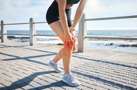 Photo for Sports woman, knee pain or red glow by beach fitness, ocean workout or sea training in healthcare wellness crisis. Legs injury, hurt or body stress for runner with burnout on medical anatomy. - Royalty Free Image