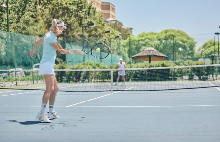 Photo for Tennis court, sports match and women outdoor for fitness, exercise and training for competition. Athlete person hit ball at club for game performance for health and wellness with summer cardio action. - Royalty Free Image