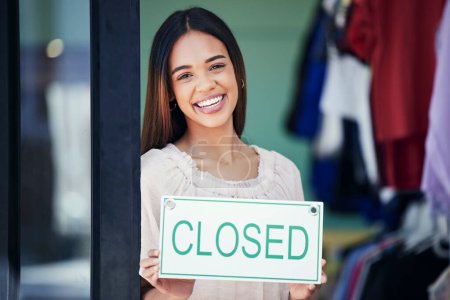 Foto de Business owner, holding and portrait of a woman with a sign for a closed shop in the afternoon. Smile, entrepreneur and retail employee showing a board for a store closure, advertising and news. - Imagen libre de derechos