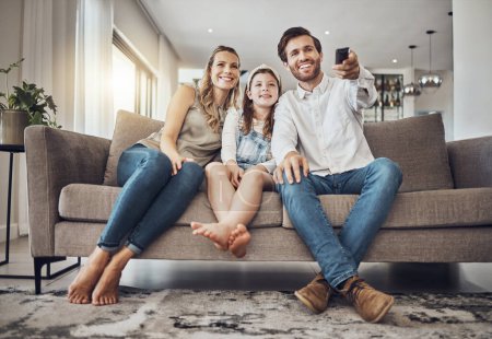 Photo for Girl, mother or father watching tv to relax as a happy family in living room bonding in Australia with love. Television, sofa or parents smile with kid enjoying quality time or movies on fun holiday. - Royalty Free Image