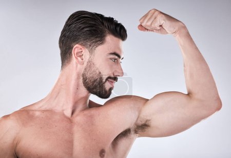 Photo for Arm muscle, strong man and body, face profile with health and fitness, muscular person isolated on studio background. Skin, bodybuilder and biceps, wellness and weightlifting exercise and growth. - Royalty Free Image