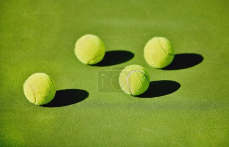 Photo for Ball, tennis and outdoor court for a game, fitness and training for sports at a stadium. Shadow, start and equipment for a sport on the ground in a pattern for action, cardio and competition. - Royalty Free Image