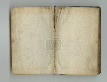 Téléchargez les photos : Vintage pages of an old text. A yellowed piece of parchment inside an old book - en image libre de droit