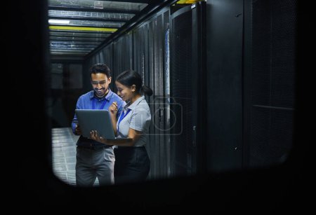 Server room, technician people and laptop for software management, system upgrade or cyber security. Teamwork, data center and engineer or programmer employees, information technology and programming.
