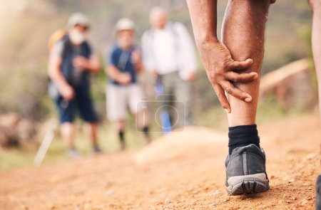 Photo for Injury, leg pain and hands of senior black man after hiking or sports accident outdoors. Training hike, elderly and male with fibromyalgia, inflammation or arthritis, broken bones or painful muscles - Royalty Free Image