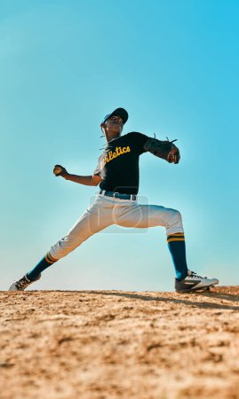 Foto de Lets see if you can hit this. a young baseball player pitching the ball during a game outdoors - Imagen libre de derechos