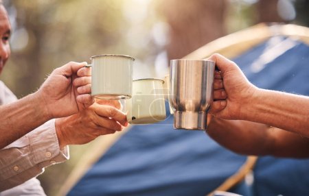 Camping hands, mugs and people toast on outdoor nature vacation for wellness, freedom or natural forest peace. Drinks, group cheers and relax friends celebrate on holiday adventure in Australia woods.