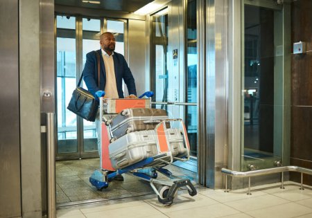 Photo for Black man, travel for business and luggage with airport and conference, exit elevator with suitcase and corporate trip. Businessman, finance convention or seminar and travelling, ready for flight. - Royalty Free Image