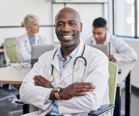 Photo for Arms crossed, portrait and a black man in healthcare workshop with vision and motivation. Happy, medicine and an expert African doctor in medical meeting, seminar or conference at a hospital. - Royalty Free Image