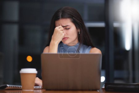 Foto de Stress, woman and night business on laptop in office with headache, doubt and depression. Tired worker, burnout and working late with mistake, anxiety and fatigue of crisis, pain and mental health. - Imagen libre de derechos