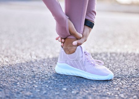 Téléchargez les photos : Pain, ankle hands and fitness injury on road or street outdoors after accident. Sports, training athlete and black woman with leg inflammation, fibromyalgia or broken bones after exercise or workout - en image libre de droit