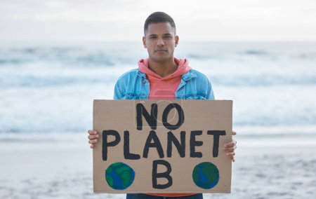 Photo for Save earth, sign and man protest at beach pollution, environment and green, eco planet. Ocean, sea and portrait of person with nature globe poster for awareness, global warming and climate change. - Royalty Free Image