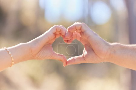 Photo for Heart hands, nature and love, support and commitment partnership for marriage outdoors. Valentines day, romance and couple, man and woman with emoji for care, relationship and affection or trust - Royalty Free Image