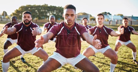 Rugby, haka or team with motivation, solidarity or support in a battle cry, war dance or challenge with unity. Performance, fitness group or athletes dancing before a game or match on a grass stadium.