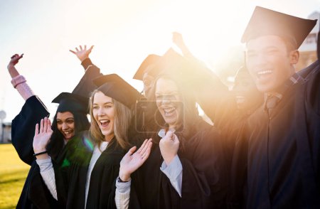 Photo for Live life with no regrets. a group of students standing together on graduation day - Royalty Free Image