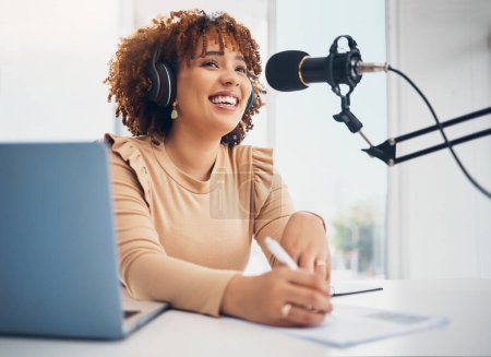 Photo for Laptop, microphone and radio with a black woman presenter talking during a broadcast while live streaming. Influencer, talk show and media with a female journalist or host chatting on a mic. - Royalty Free Image