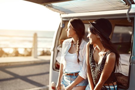 Photo for Savouring every moment of the trip. two happy young friends enjoying a relaxing road trip - Royalty Free Image