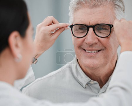 Foto de Glasses check, senior vision and elderly man at a consulting optometry clinic for wellness. Happy, smile and old face with lens, frame and eyewear choice in a store for help getting a prescription. - Imagen libre de derechos
