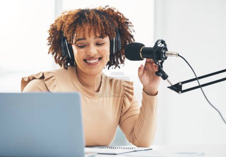 Photo for Laptop, microphone and media with a black woman presenter talking during a broadcast while live streaming. Influencer, talk show and radio with a female journalist or host chatting on a mic. - Royalty Free Image