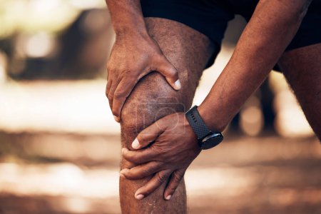 Photo for Knee pain, senior hands and injury in nature after accident, workout or training. Sports, athlete health and elderly black man with fibromyalgia, inflammation or tendinitis, arthritis or painful legs. - Royalty Free Image