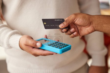 Photo for Hands, credit card and payment on pos machine for fintech, banking or ecommerce. Digital purchase, technology and man or customer buying, paying or tap on device for retail sales, shopping or b2c - Royalty Free Image
